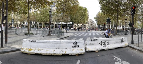 Concrete blocks of police prevent traffic on the Avenue Champs-Elysees