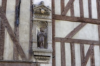Sculpture on the facade of half-timbered houses in the old town centre of Troyes