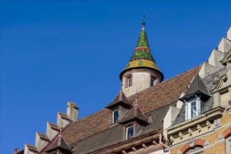 The roof of the building in Obere Strasse with small Bunte tower and skylights in the old town