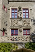 Detail of the magnificent facade with figures and coat of arms of the Hohenzollern Castle Sigmaringen