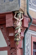 Detail of the corner of Tuebingen's historic town hall building with a carved female figure