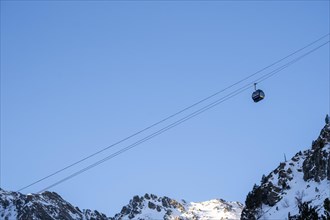 Winter journey unfolds cable car amid Andorra's snowy peaks alpine wonder