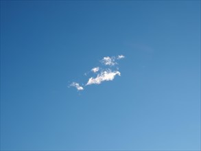 Blue sky with a small cloud background
