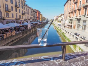 Naviglio Grande Milan and plastic cup with straw