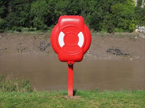 Life buoy on river bank