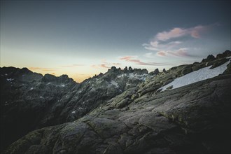 Rocks and snowfields at dawn