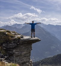 Mountain panorama with hiker on rocks in Gastein