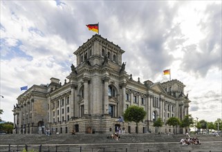Reichstag building with waving German flag