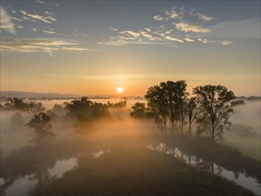 Aerial view of the Radolfzeller Aach in the Radolfzeller Aachried at sunrise and ground fog