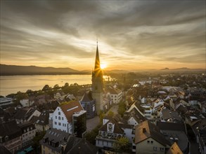 Aerial view of the historic town centre of Radolfzell on Lake Constance shortly in front of sunset. In the centre of the picture the Radolfzell Minster and the market square