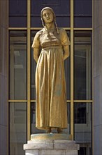 Golden female statue by Felix Alexandre Desruelles