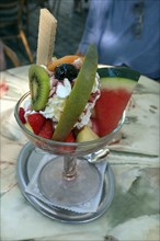 Ice cream sundae with fruit in an Italian ice cream parlour