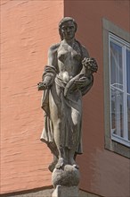Sculpture of a woman on a corner house
