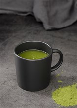 Matcha tea cup with powder