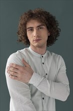 Portrait curly haired young man 4