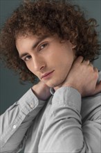 Portrait curly haired young man 6