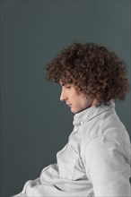 Portrait curly haired young man 10