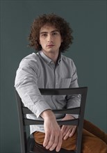 Portrait curly haired young man 12