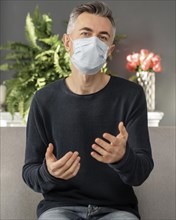 Portrait man with mask therapy office