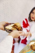 Ramadan concept with woman receiving food