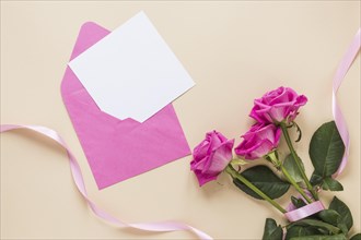 Rose flowers with paper envelope