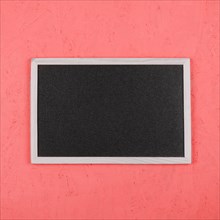 Small blank blackboard coral painted wall