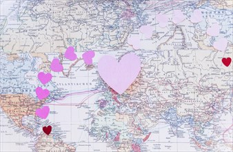 Small colourful paper hearts world map