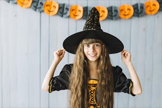 Smiling little witch halloween party