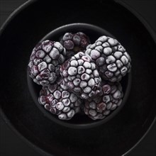 Sweet frozen blackberries close up
