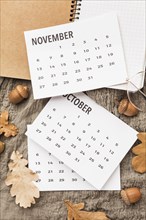 Top view calendar with autumn acorns leaves