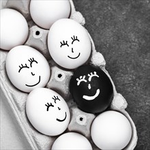 Top view many different colored eggs with faces black lives matter movement