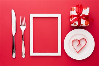 Top view paper heart shape plate with frame cutlery