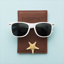 Top view summer glasses with passport