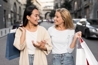 Two women out city going shopping spree