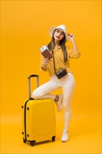 Woman being ready vacation with luggage travel essentials
