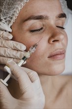Woman getting facial beauty treatment wellness center