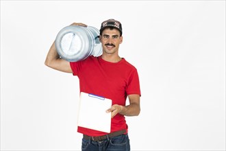 Young deliveryman with water carafe