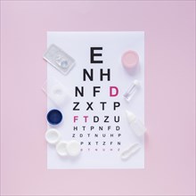 Alphabet table optical consultation pink background