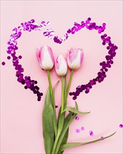 Bouquet flowers heart frame pink background