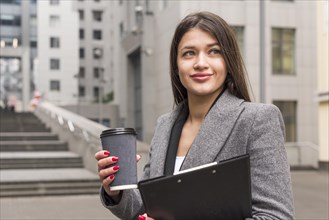 Brunette businesswoman with coffee