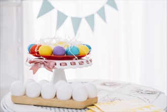 Colorful easter eggs with white eggs table home