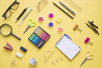 Colorful stationeries yellow background