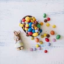 Cute bunny near easter sweets