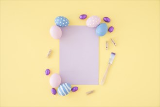 Easter eggs with blank purple paper table