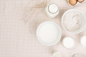Elevated view flour milk sugar egg checkered napkin
