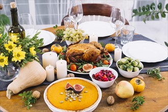 Festive table with baked chicken vegetables