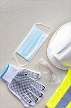 Flat lay safety construction gloves medical mask