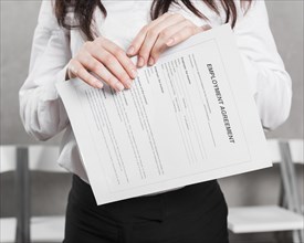 Front view woman from human resources holding contract