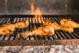 Grilled chicken legs hot grill with heavy fire