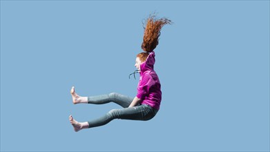 Happy young woman jumping 3